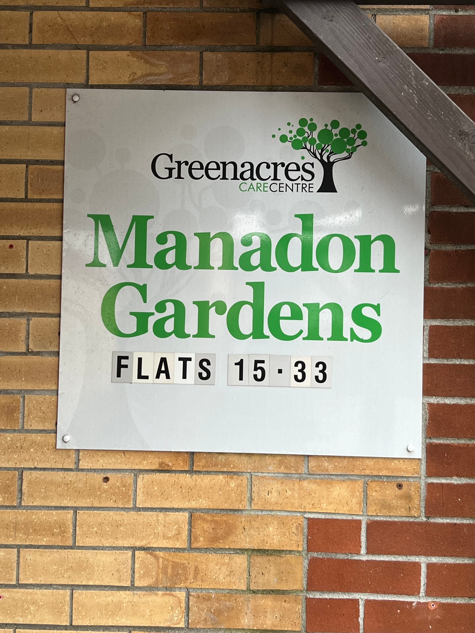 Wall-mounted development name plate by Omega Print & Signs